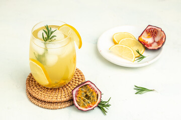 passionfruit cocktail. Tropical drink for summer party. on a light background, refreshing drink or beverage with ice, place for text