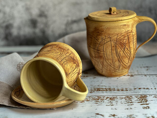 Unique ceramics. Thread-like pattern.Inside the glaze. Cup and saucer, jug.