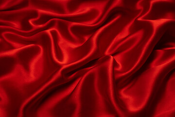 Red silk or satin luxury fabric texture can use as abstract background.