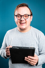 smiling man with tablet