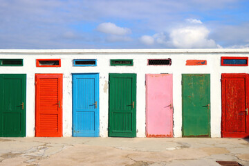 Colorful changing cabins, landmark on beach Jadrija, in Sibenik, Croatia.