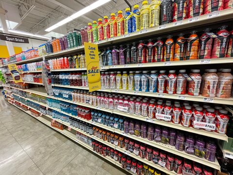 Grocery store sports drink section powerade side view