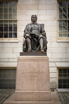 Statue of John Harvard in Harvard university yard, on January 22, 2023, Cambridge, Massachusetts, USA