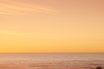 Sunset over the tranquil sea. A scenic sunset over the ocean - copyspace.