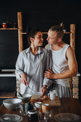 Young couple in love cook healthy food in the kitchen together. 