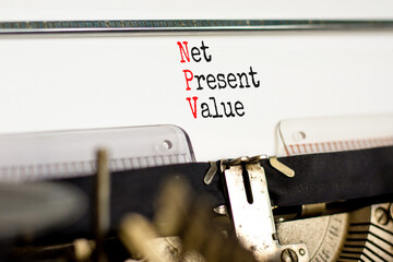 NPV net present value symbol. Concept words NPV net present value typed on retro old typewriter on a beautiful white paper background. Business and NPV net present value concept. Copy space.