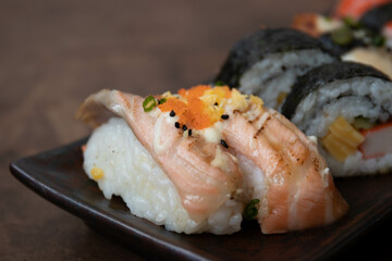 Mixed Japanese food, Sushi Roll, on black background