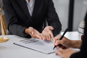 lawyer working with contract agreement at table office, law and justice concept, Selective focus.