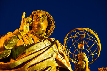 2022-07-04. Nicolaus Copernicus Monument. evening statue in front of the Old Town Hall, Torun,...
