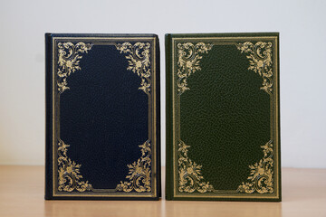 Blue and green cover of vintage books bound in leather
