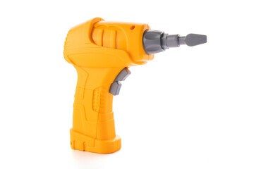 Yellow plastic toy drill screwdriver with bit isolated on white background