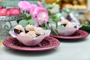 white brigadeiro, sweets with coconut shavings, candy table, candy store,  condensed milk candy balls, candy balls