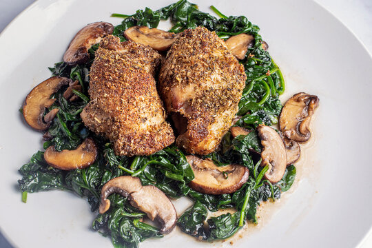 Bone Less Chicken Thighs  On Sauteed Spinach And  Mushrooms