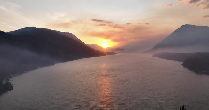 Panoramic Aerial View Above Lake Wenatchee Washington USA at Sunset Smoke Filled Sky From Forest Fires