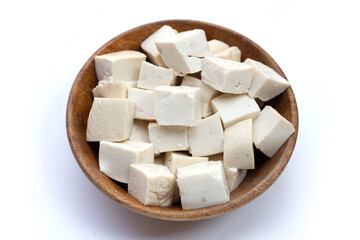 White tofu in wooden bowl on white background.
