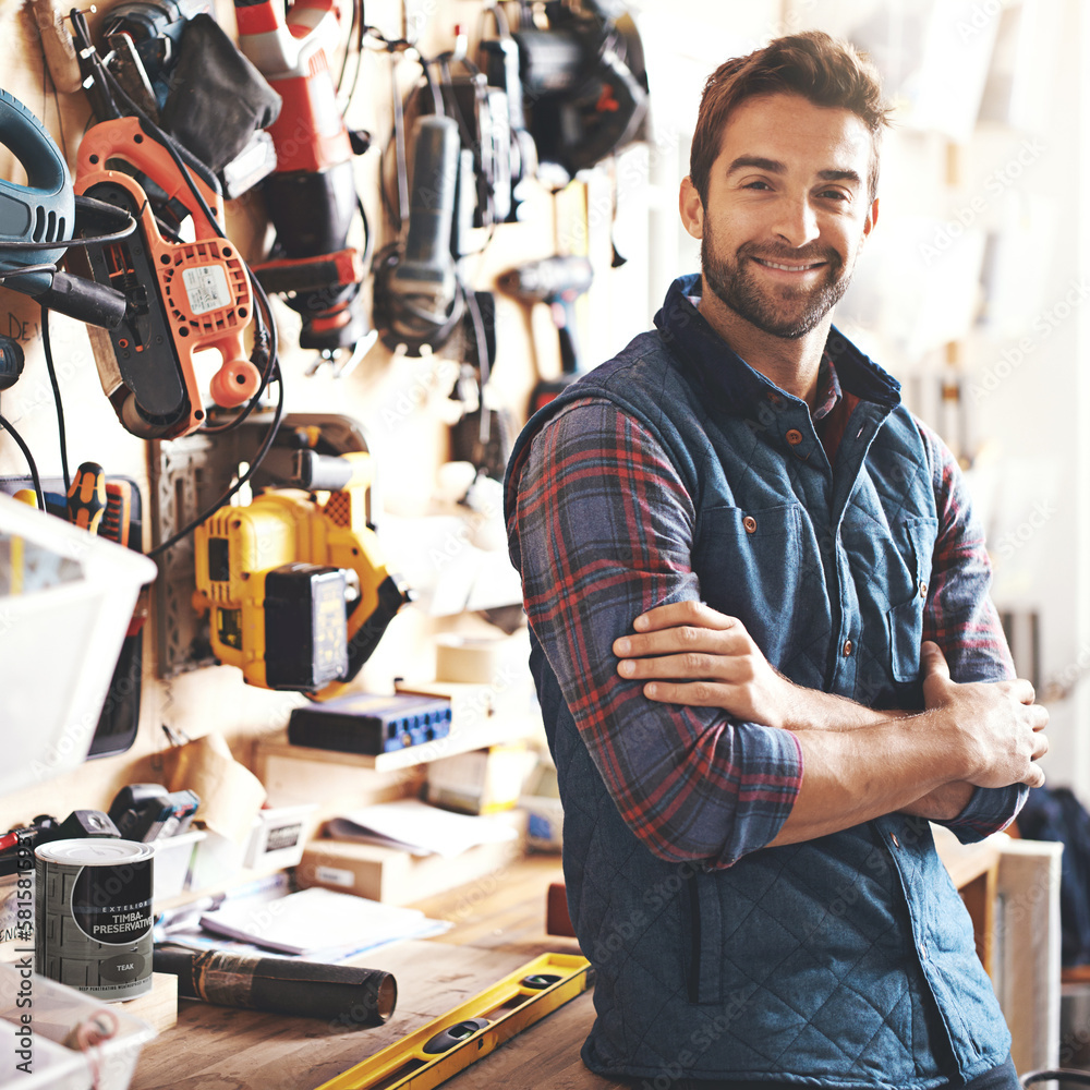 Poster you name it, ive got it. portrait of a man standing in his workshop.