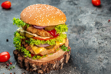 Beef burger with double cutlet on the wooden board. fast food and junk food concept