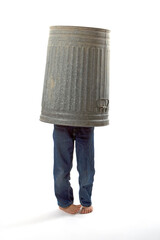 a chilling hiding under a classic metal garbage can.