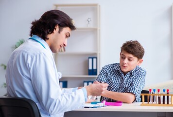 Obraz premium Boy in blood tranfusion concept