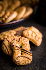 Assorted various cookies. Sweet biscuits  on black table.