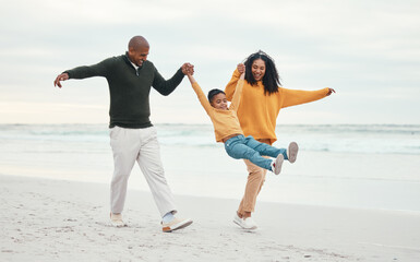 Play, mother and father with child on beach enjoy holiday, travel vacation and weekend together. Happy family, parents and dad, mom and kid holding hands for bonding, quality time and swinging by sea