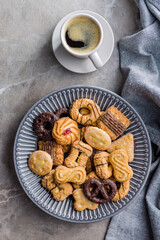 Assorted various cookies. Sweet biscuits on plate. Top view.