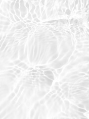 Defocus blurred transparent white colored clear calm water surface texture with splashes and...
