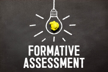 Formative Assessment top view of text near white keyboard.