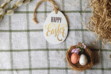 Wonderful Easter decorations. Nest with chicken eggs and willow branches. Happy Easter. Space for text. Easter concept
