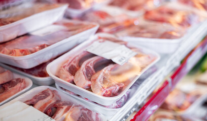 Packaged mutton meat displayed on shelves of animal products section of supermarket