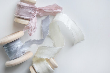Pastel color of silk ribbon. Handmade. Fashion art material decoration on the table in wedding event.

