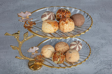 Dry cake and Chocolate truffles, dry biscuits, cookie. Patisserie snacks. Sesame dry cakes closeup...