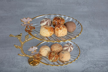 Dry cake and Chocolate truffles, dry biscuits, cookie. Patisserie snacks. Sesame dry cakes closeup...