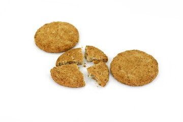 Fototapeta na wymiar Round oatmeal cookies on white isolated background