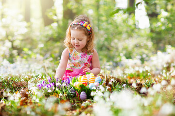 Easter egg hunt. Kids with eggs.