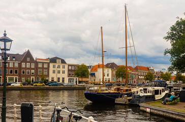 Overcast cityscape of Haarlem, North Holland, Netherlands. View of Spaarne River embankment.
