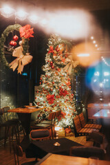 christmas tree with christmas decorations in restaurant