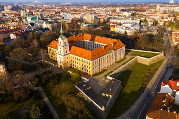 Fototapeta na wymiar Aerial view of Renaissance building of Rzeszow castle on background of modern cityscape in springtime, Poland