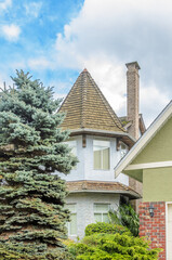 The roof of the house with nice window.