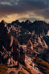 Jagged Mountain Ridge, With Sunset, Giving Off Vibrant Orange and Yellow Hues, Vertical Shot