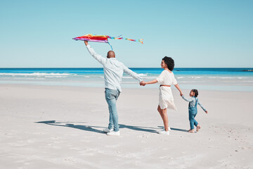 Holding hands, kite and family walking together at a beach, relax and bonding on ocean background. Flying, toy and couple with daughter at the sea, walk and enjoy a trip in Miami with fun games
