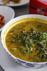 Red curry cockle with Acasia. Thai Food Spice Dish decorate Red Chili and Piper beetle Leaf . 