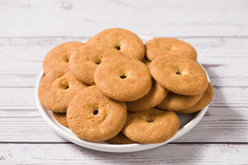 crispy  round biscuits. Sweet cookies on wooden table.