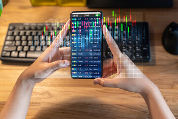 Businesspeople press the phone to communicate in the Internet Stock chart Researching process.business Team Working Startup modern office