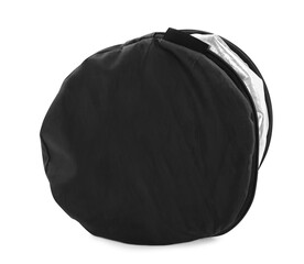 Bag with studio reflector isolated on white. Professional photographer's equipment