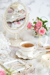 Obraz na płótnie Canvas still life tea, flower, mirror,candle. brightmood concept