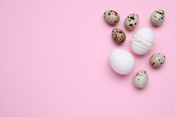 Easter eggs on pink background, flat lay. Space for text