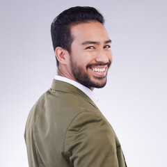 Fototapeta premium Happy, smile and portrait of man in studio for professional, corporate and positive. Confidence, happiness and executive with male isolated on gray background for pride, elegant and opportunity