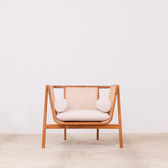 Fototapeta na wymiar Relaxing chair made of rattan combination wood, complete with foam cushions and seats