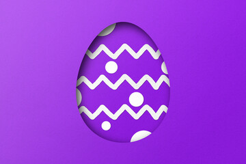 Purple paper cut to form an Easter egg pattern.